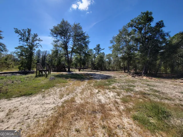 a view of swimming pool with a yard