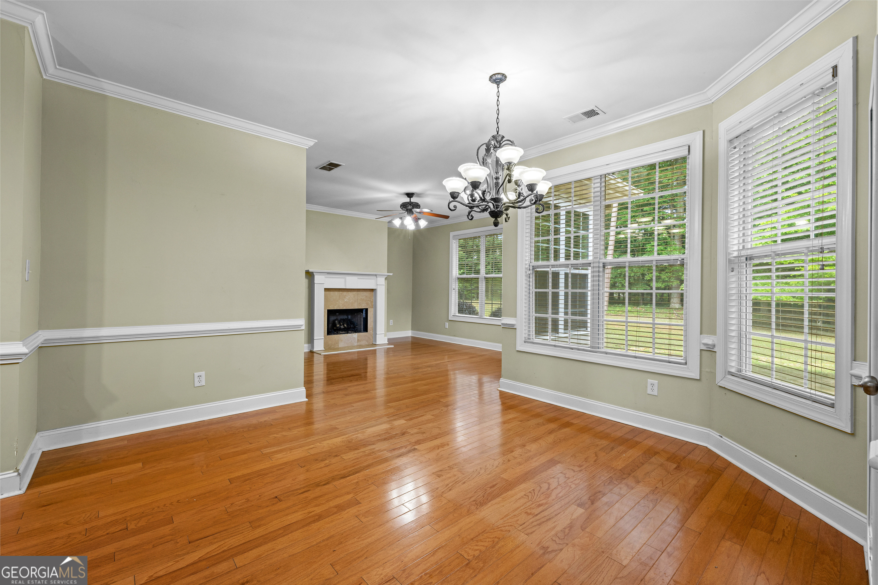 120 Shankhill Ridge Tyrone, GA 30290 - Photo 12 of 54 a view of an empty room with wooden floor and a window