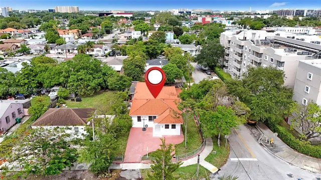 a view of a livingroom with furniture and hardwood floor