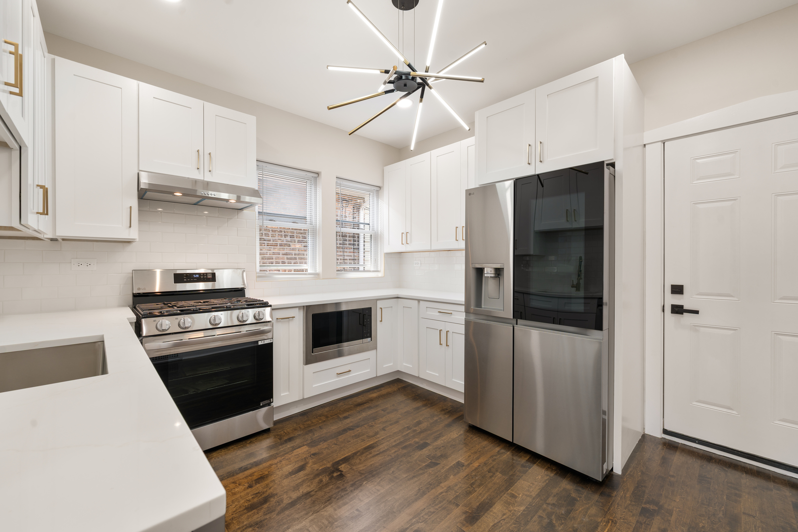 4230 North Monitor Avenue Chicago, IL 60634 - Photo 13 of 40 a kitchen with a stove and a refrigerator