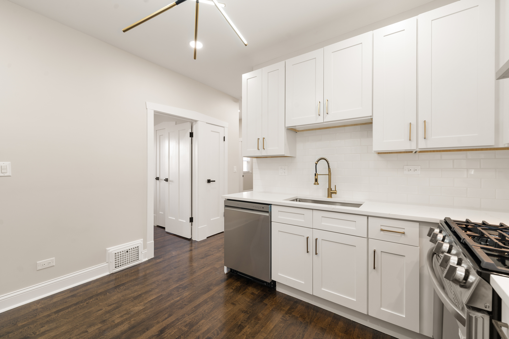 4230 North Monitor Avenue Chicago, IL 60634 - Photo 15 of 40 a kitchen with a sink a cabinetry and cabinets