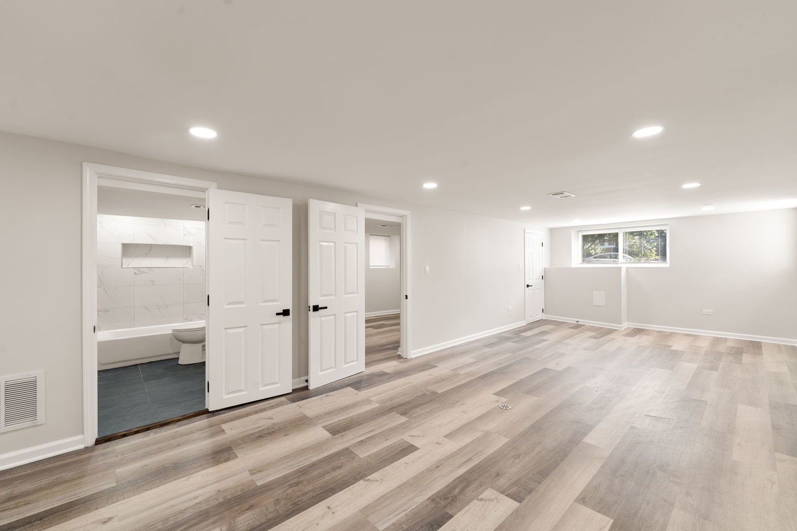 4230 North Monitor Avenue Chicago, IL 60634 - Photo 23 of 40 an empty room with wooden floor and windows