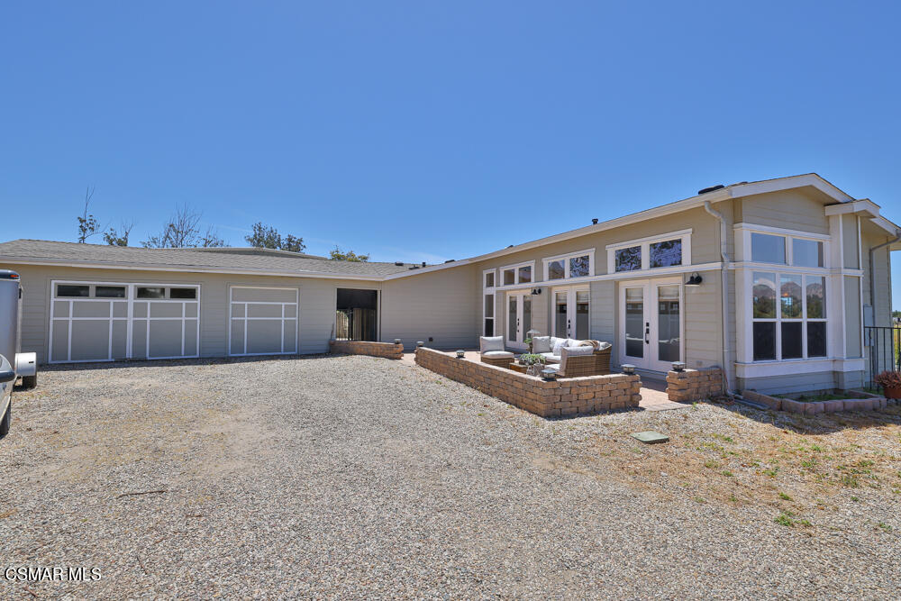 6500 Meadowglade Drive Moorpark, CA 93021 - Photo 12 of 64 a view of a house with backyard and sitting area