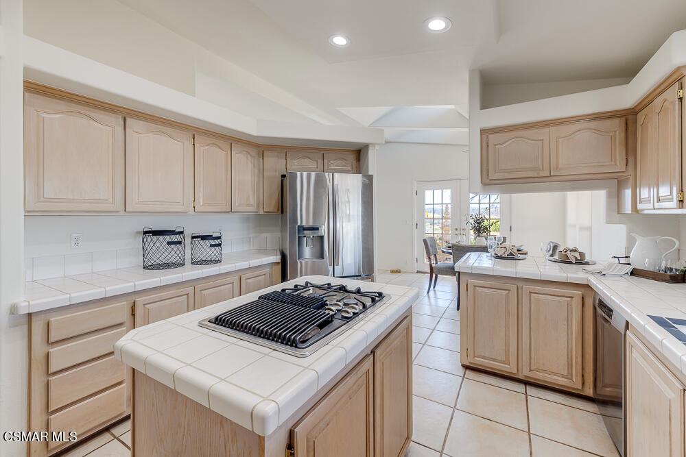 6500 Meadowglade Drive Moorpark, CA 93021 - Photo 25 of 64 a kitchen with a stove a sink dishwasher and a refrigerator