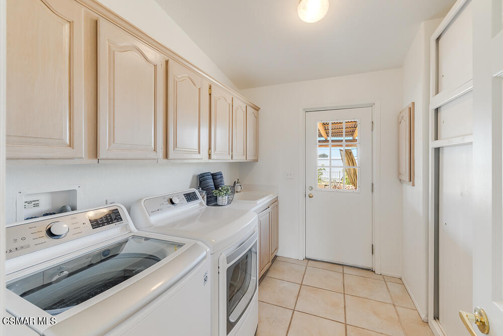 6500 Meadowglade Drive Moorpark, CA 93021 - Photo 29 of 64 a utility room with sink dryer and washer