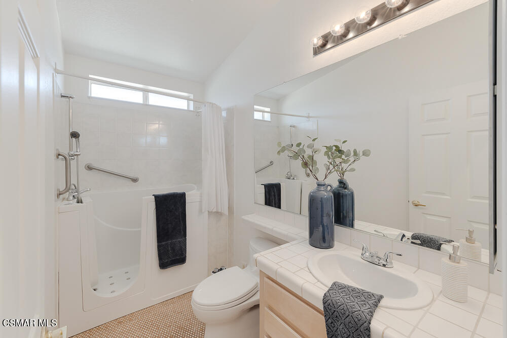 6500 Meadowglade Drive Moorpark, CA 93021 - Photo 30 of 64 a bathroom with a sink toilet and shower