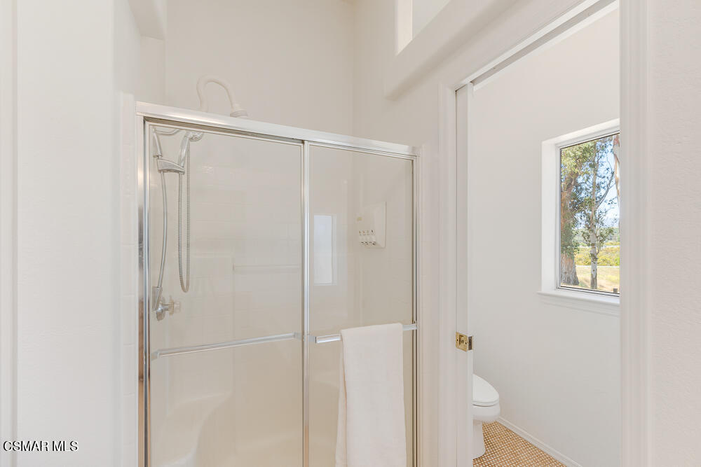 6500 Meadowglade Drive Moorpark, CA 93021 - Photo 39 of 64 a bathroom with a glass shower door