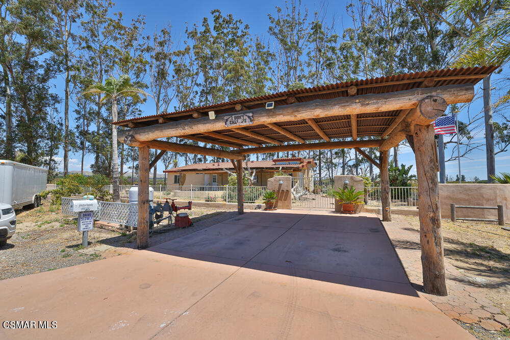 6500 Meadowglade Drive Moorpark, CA 93021 - Photo 45 of 64 a view of a patio with table and chairs under an umbrella