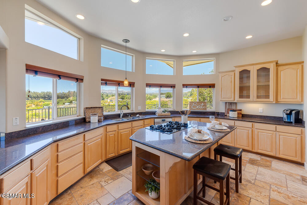6500 Meadowglade Drive Moorpark, CA 93021 - Photo 50 of 64 a kitchen with a sink stove and cabinets