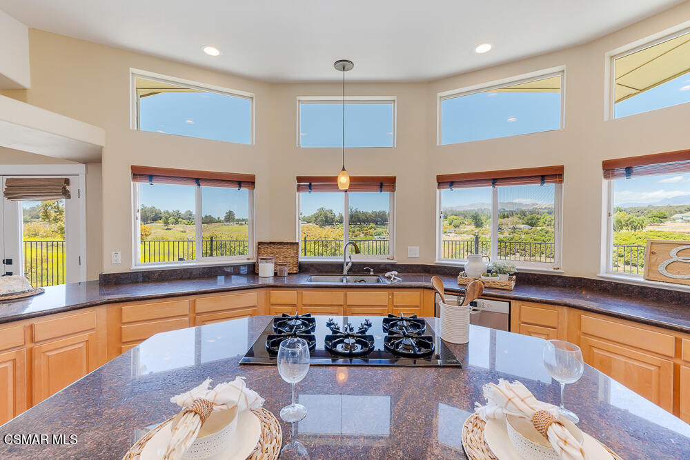 6500 Meadowglade Drive Moorpark, CA 93021 - Photo 51 of 64 a large kitchen with stainless steel appliances granite countertop a stove and a large window