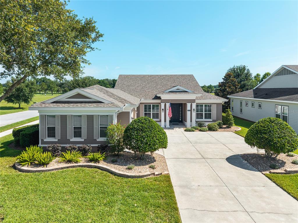 5093 Northwest 35th Ln Road Ocala, FL 34482 - Photo 1 of 1 a front view of house with yard and green space