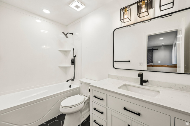 3215 West 450 North West Point, UT 84015 - Photo 17 of 40 Bathroom featuring a white vanity with an integrated sink, black hardware, and a quartz-finish countertop