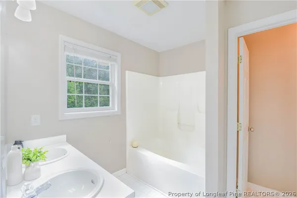 a bathroom with a sink vanity and a mirror