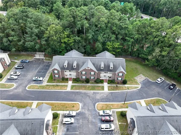 an aerial view of a house with a swimming pool