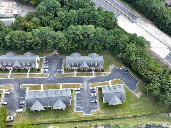 an aerial view of house with yard swimming pool and outdoor seating