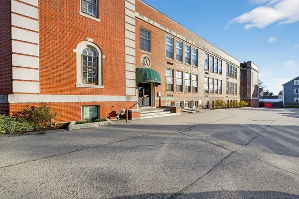 a front view of a building with street view