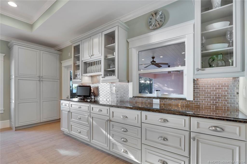 51 North River Road Stuart, FL 34996 - Photo 16 of 59 a kitchen with cabinets and window