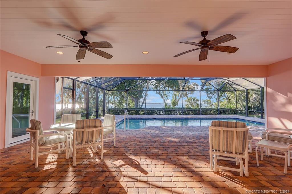 51 North River Road Stuart, FL 34996 - Photo 32 of 59 a view of a chairs and table in the patio