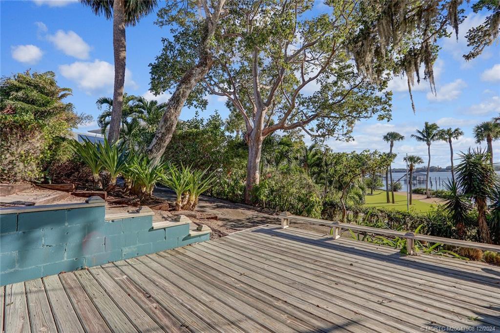 51 North River Road Stuart, FL 34996 - Photo 38 of 59 a view of a house with pool and sitting area