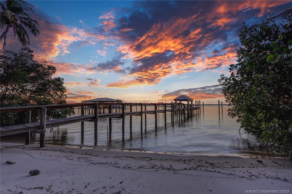 51 North River Road Stuart, FL 34996 - Photo 57 of 59 a view of a backyard with large trees