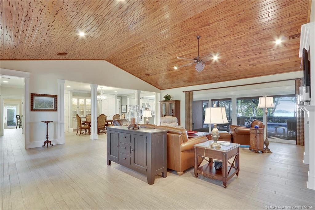 51 North River Road Stuart, FL 34996 - Photo 7 of 59 a living room with furniture and a chandelier