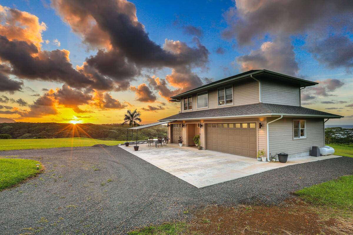 4858 Kahiliholo Road, Unit #3 Kilauea, HI 96754 - Photo 2 of 22 a view of a house with a yard