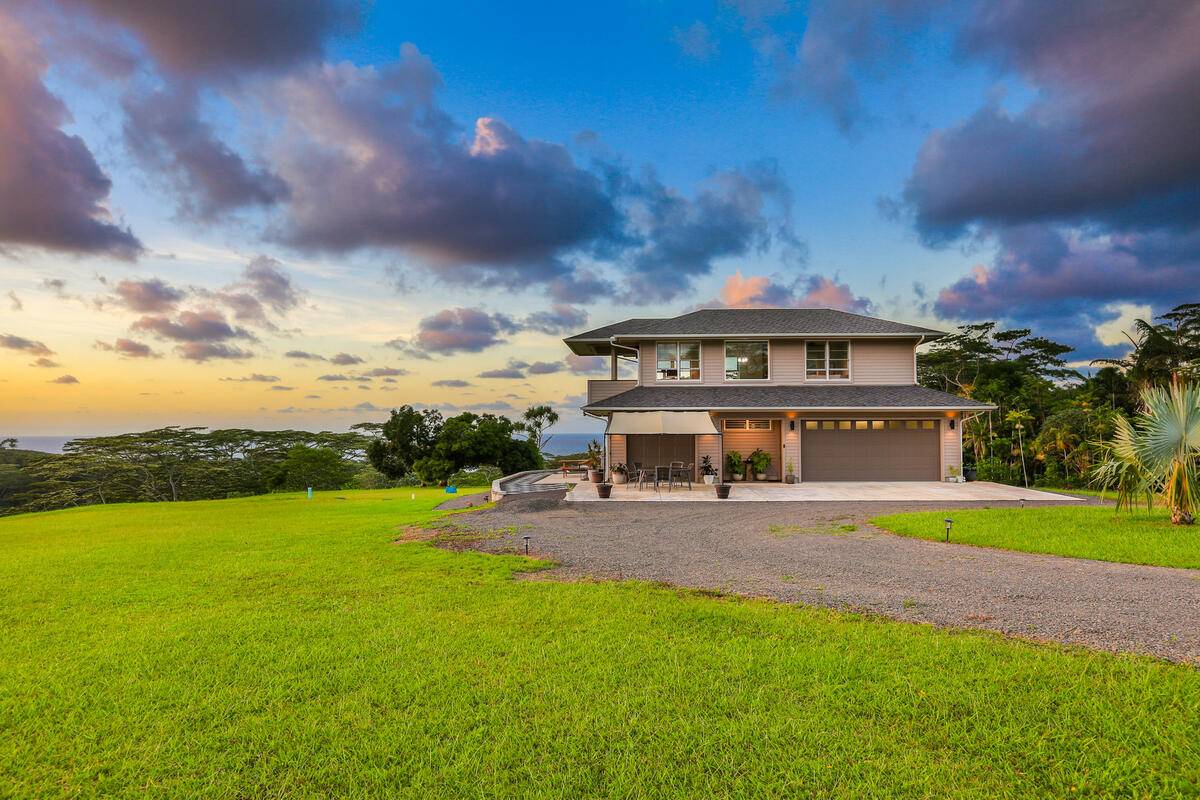 4858 Kahiliholo Road, Unit #3 Kilauea, HI 96754 - Photo 21 of 22 a view of an house with swimming pool garden and trees