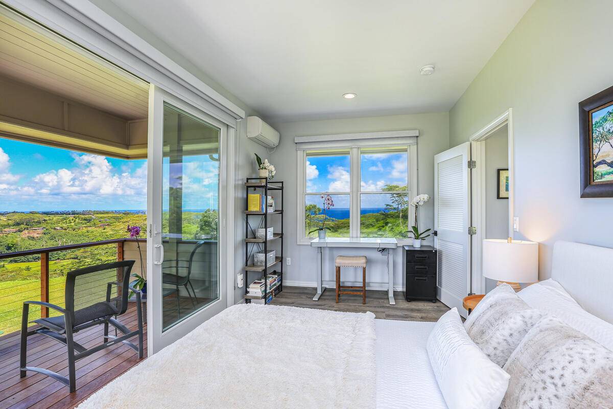 4858 Kahiliholo Road, Unit #3 Kilauea, HI 96754 - Photo 7 of 22 a bed room with a bed and a window