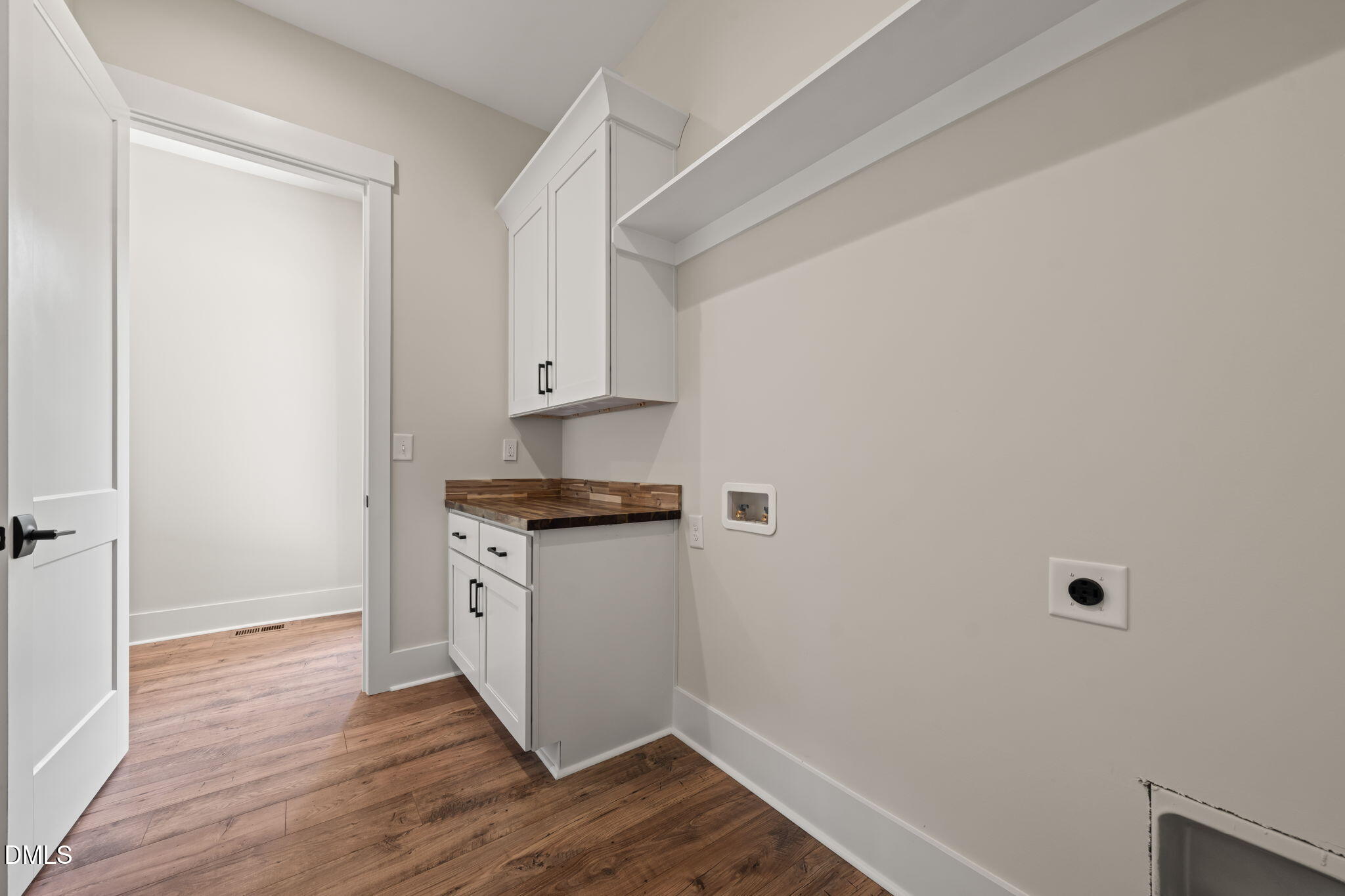 400 Pilot Ridge Road Zebulon, NC 27597 - Photo 23 of 51 a room with a white cabinets and wooden floor