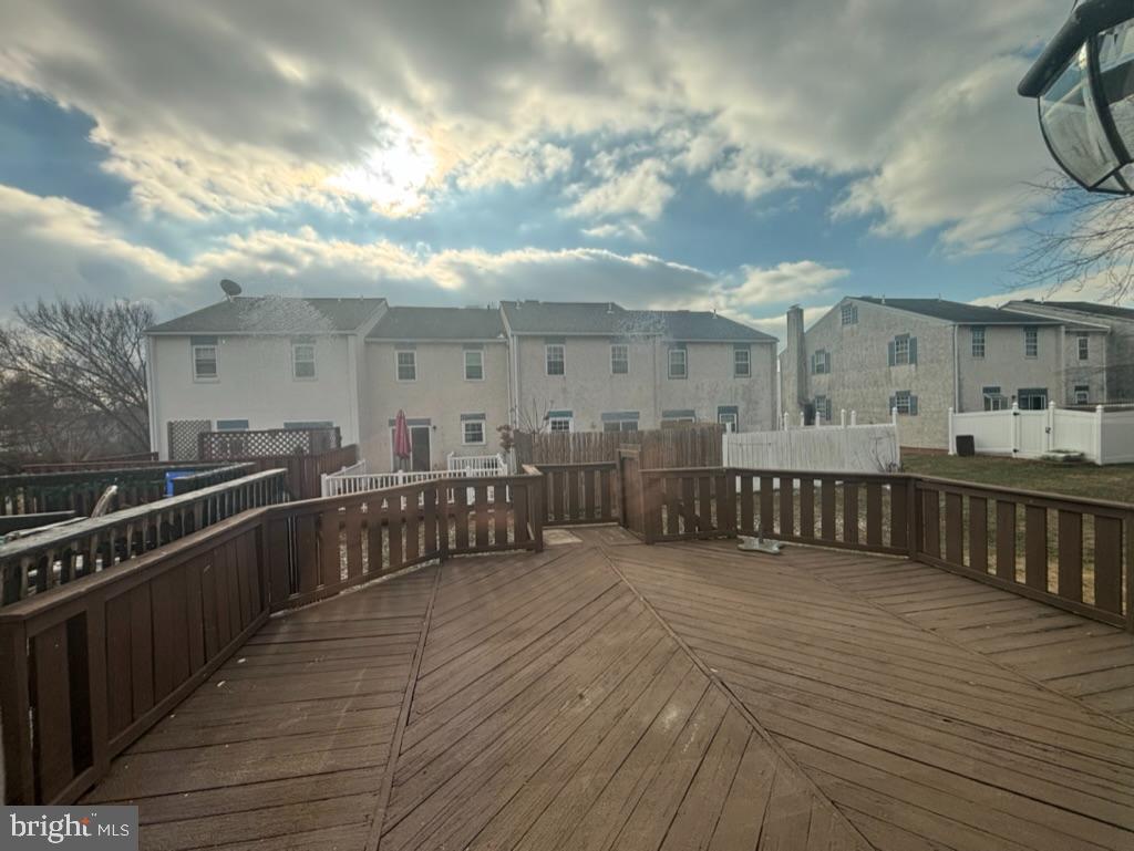 3106 Walnut Ridge Drive Pottstown, PA 19464 - Photo 14 of 14 a view of a balcony with wooden floor and fence