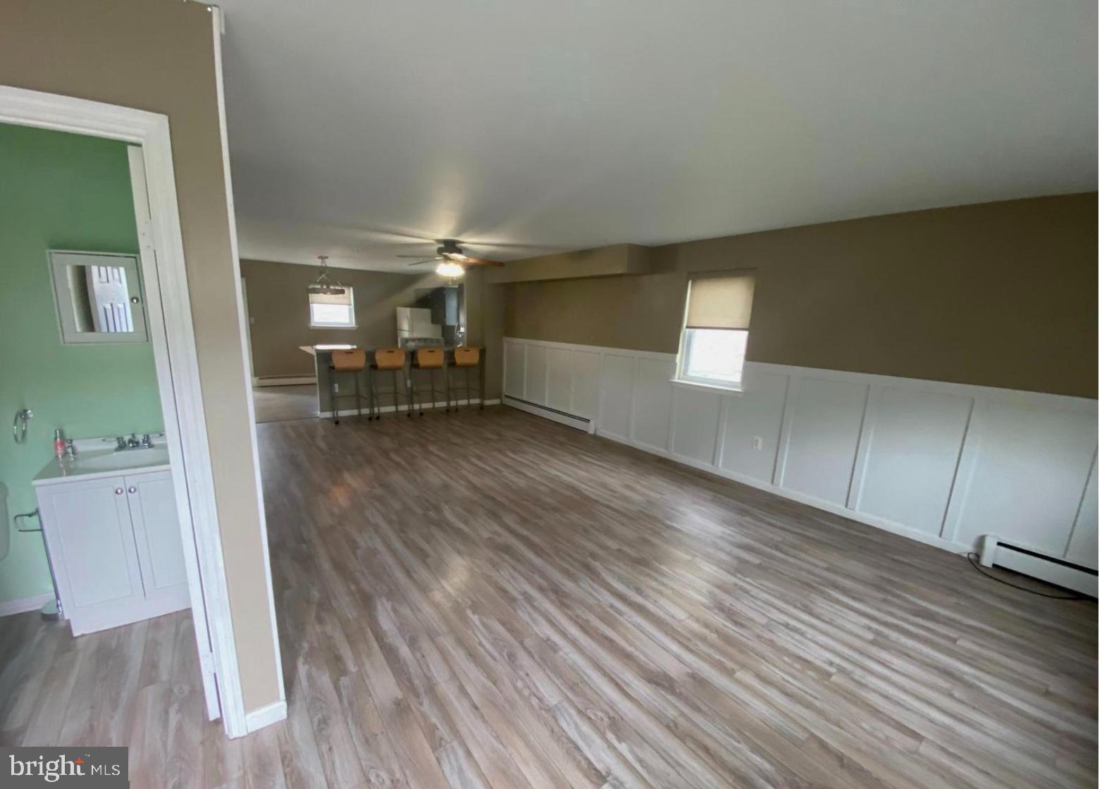 3106 Walnut Ridge Drive Pottstown, PA 19464 - Photo 5 of 14 wooden floor in an empty room with a window