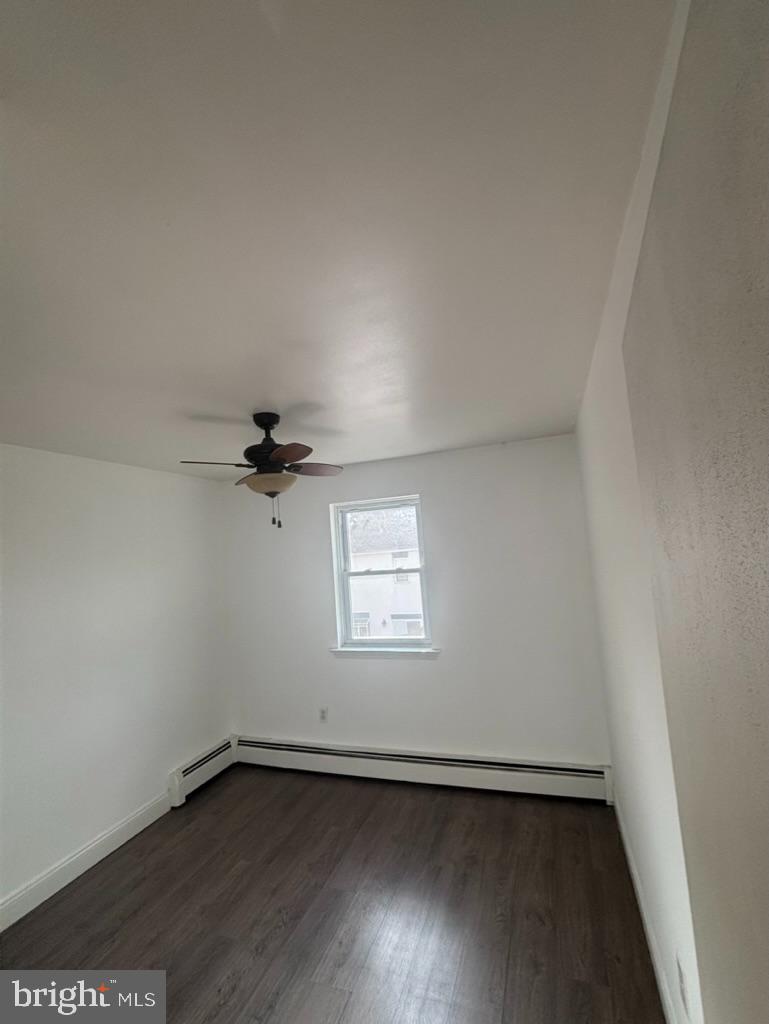 3106 Walnut Ridge Drive Pottstown, PA 19464 - Photo 8 of 14 an empty room with wooden floor and windows