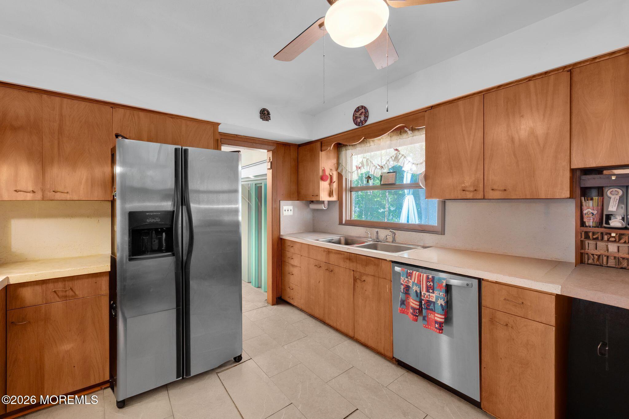 2604 Logan Road Asbury Park, NJ 07712 - Photo 10 of 39 a kitchen with granite countertop a refrigerator and a sink