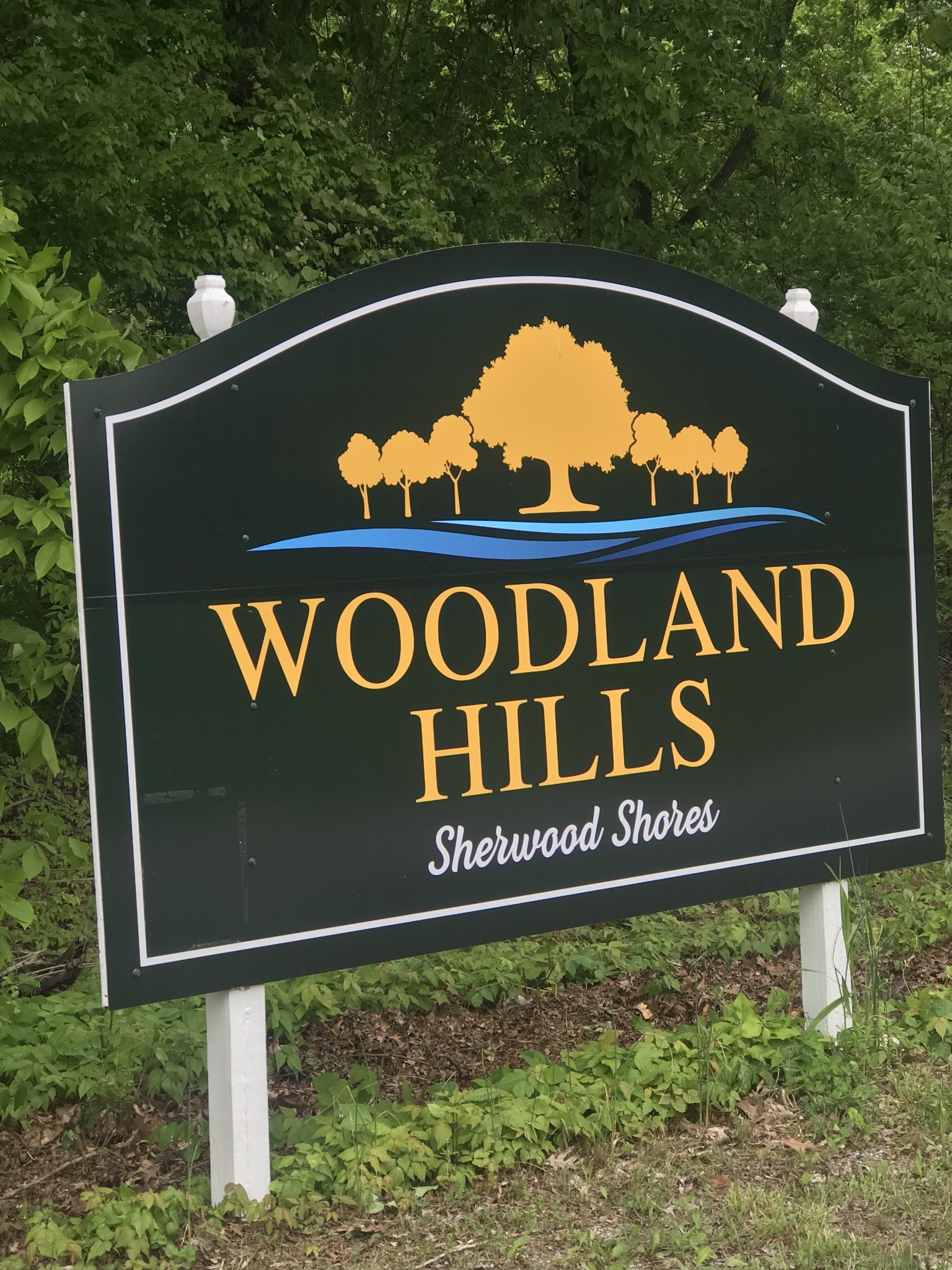 a blue sign that is on the side of a building