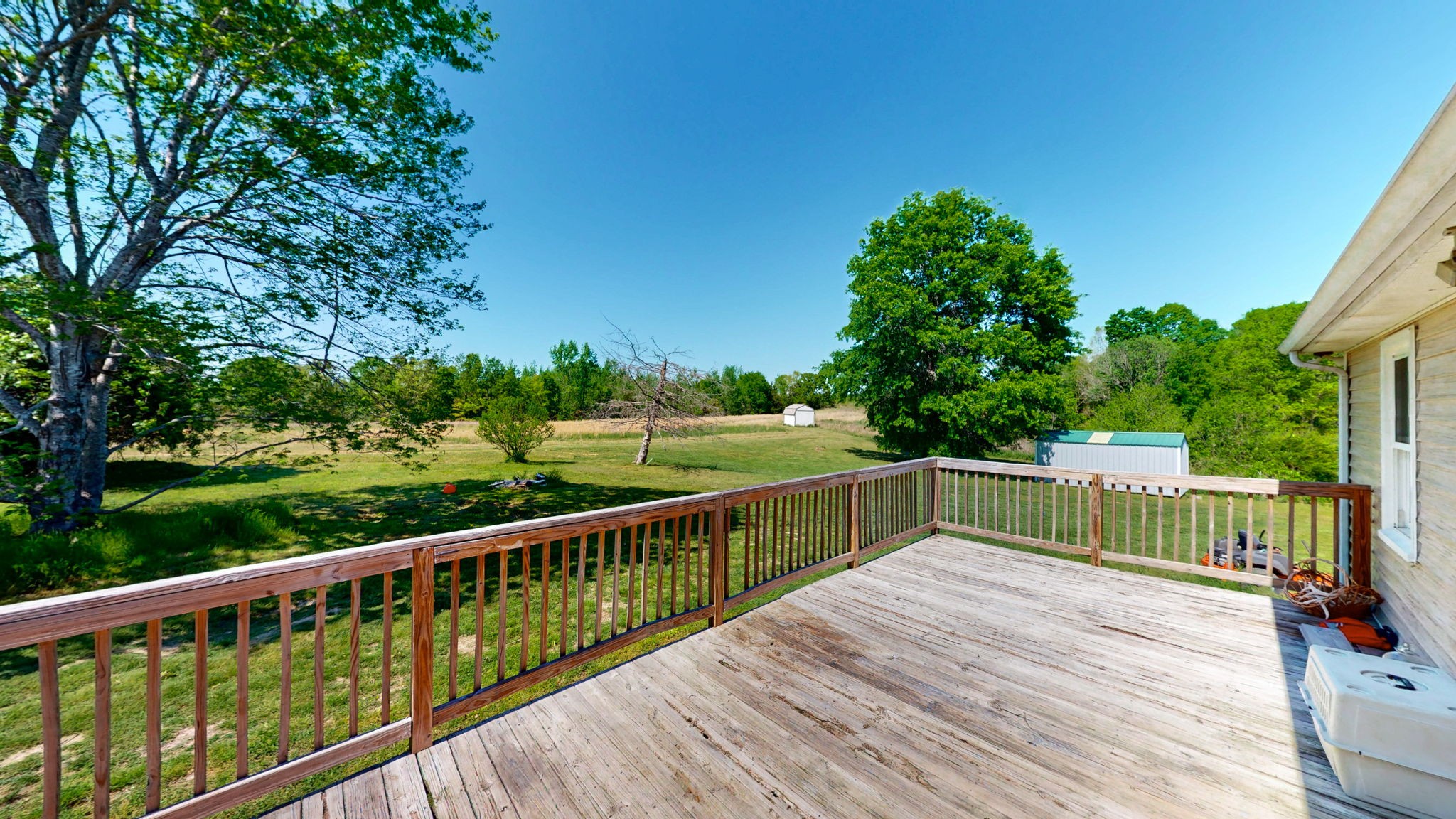 881 Coaling Road Charlotte, TN 37036 - Photo 20 of 29 a view of balcony with deck and trees