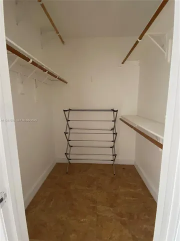 a view of an empty walk in closet