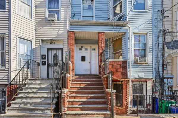 front view of a house with a clock on a wall