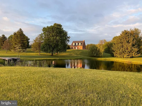 a view of a lake with houses in the back