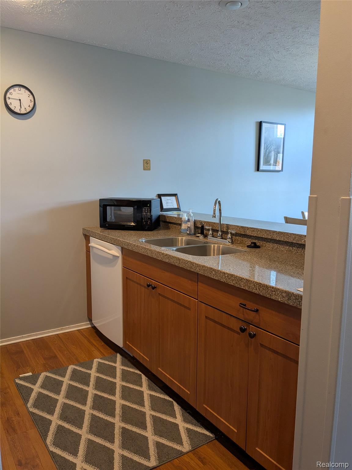 4749 South Pleasantview Road, Unit 20 Harbor Springs, MI 49740 - Photo 11 of 44 Natural Color Cabinets, Dishwasher, & Double Basin Sink