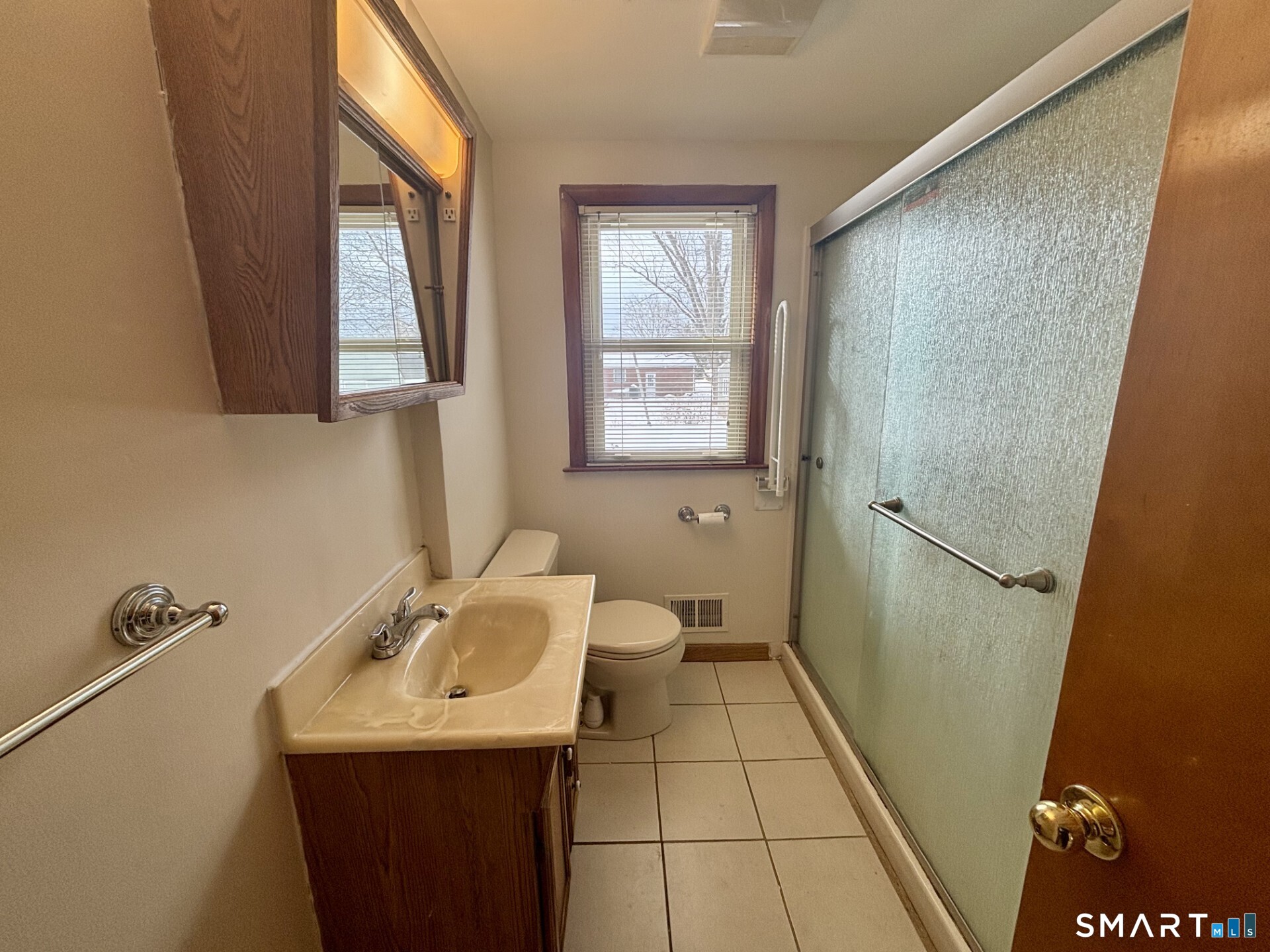 148 Edgewood Drive Torrington, CT 06790 - Photo 6 of 8 a bathroom with a sink a toilet and a mirror