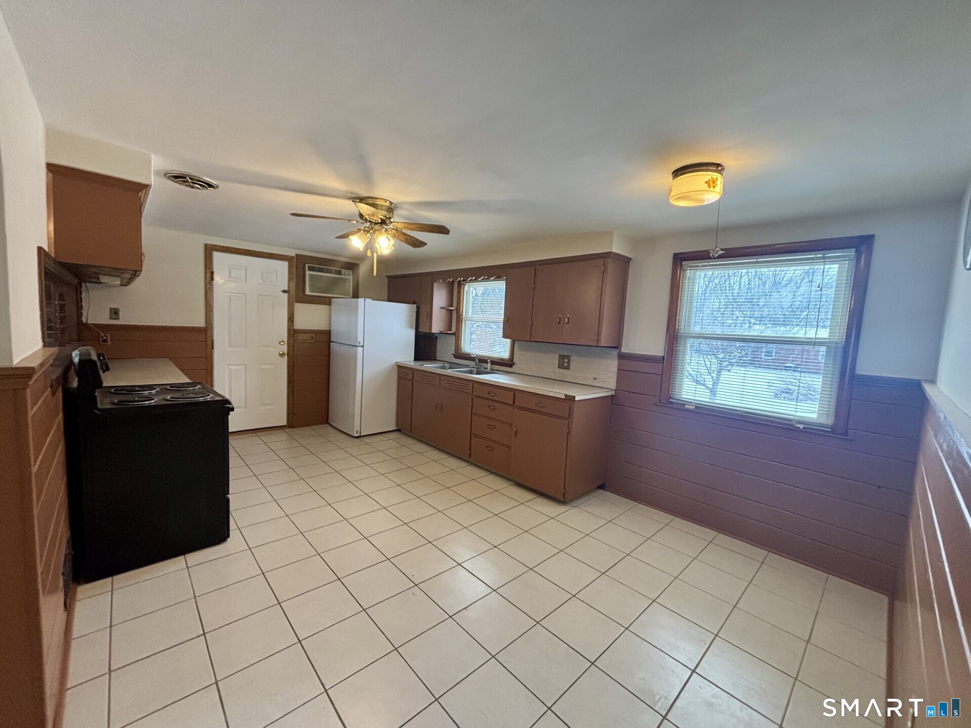 148 Edgewood Drive Torrington, CT 06790 - Photo 7 of 8 a kitchen with refrigerator and window