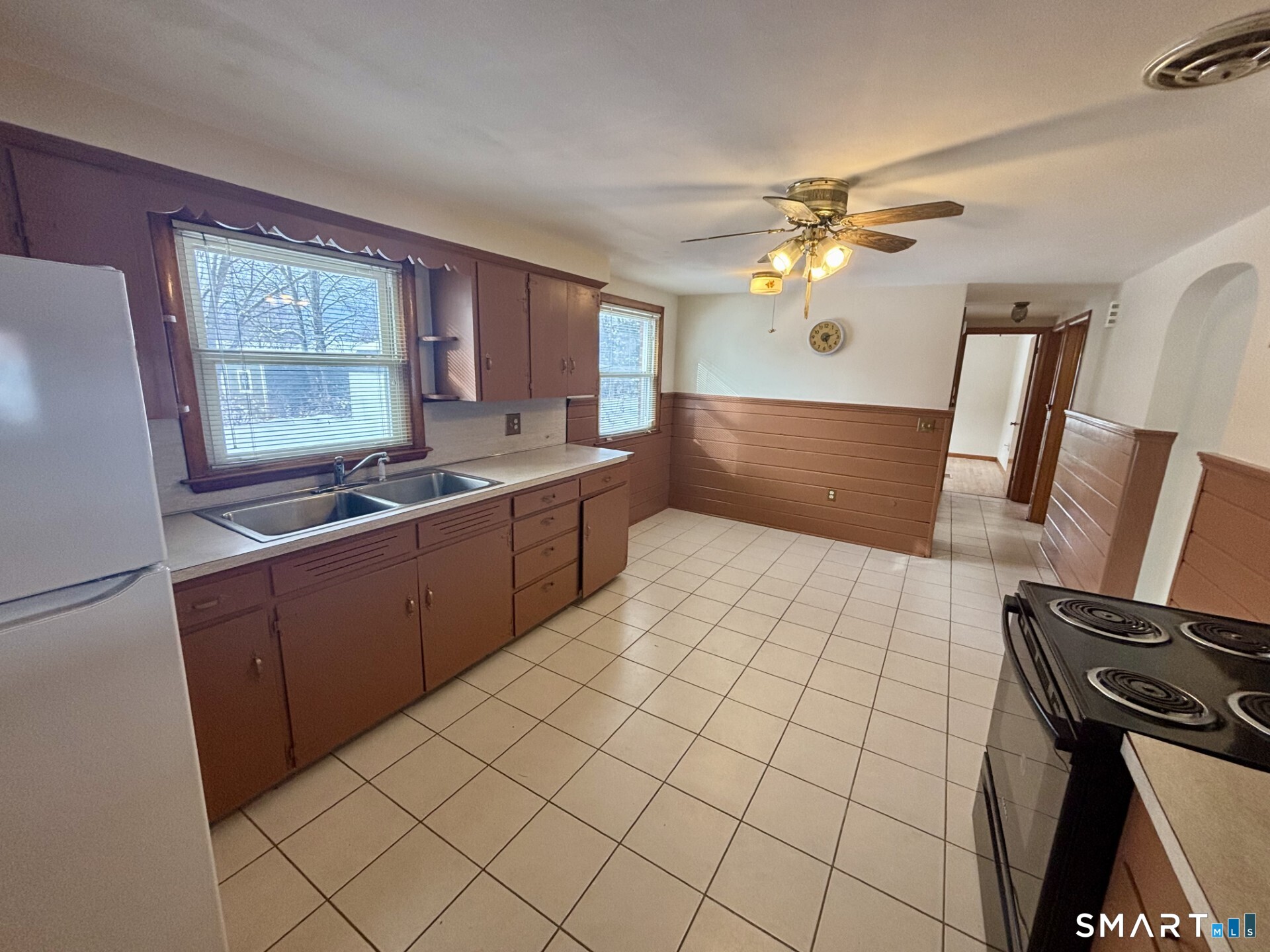 148 Edgewood Drive Torrington, CT 06790 - Photo 8 of 8 a kitchen with a sink appliances and cabinets