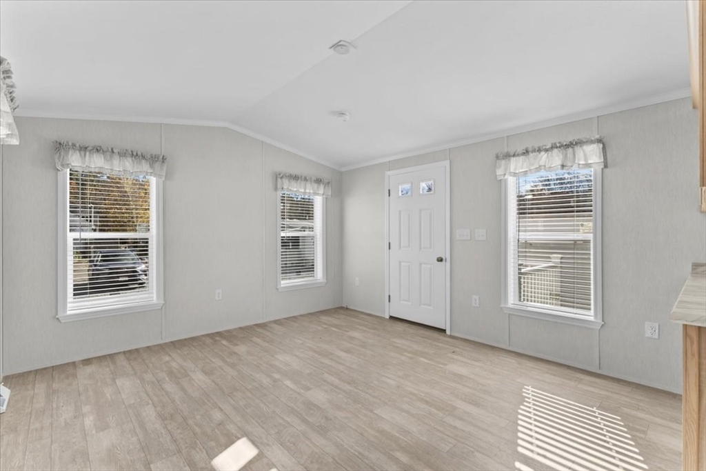 1540 Broadway, Unit 35 Raynham, MA 02767 - Photo 11 of 21 a view of an empty room with a window