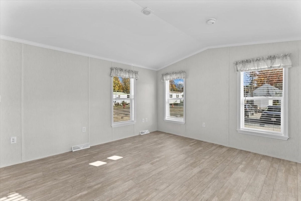1540 Broadway, Unit 35 Raynham, MA 02767 - Photo 12 of 21 a view of an empty room with a window
