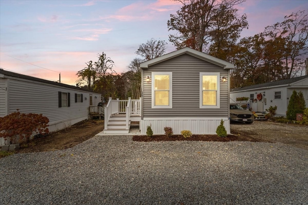 1540 Broadway, Unit 35 Raynham, MA 02767 - Photo 4 of 21 a view of a house with a yard
