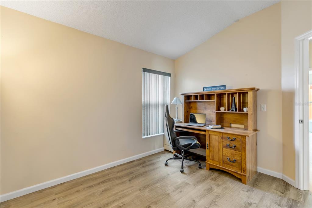 12232 Bronson Way Orlando, FL 32824 - Photo 17 of 32 a view of a workspace with furniture and a window