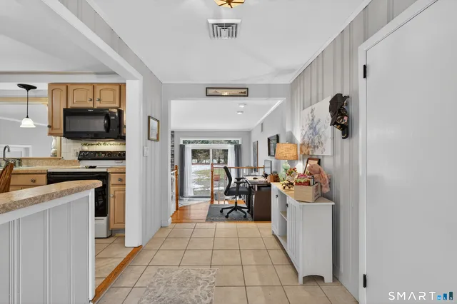 a view of a kitchen with living room and furniture
