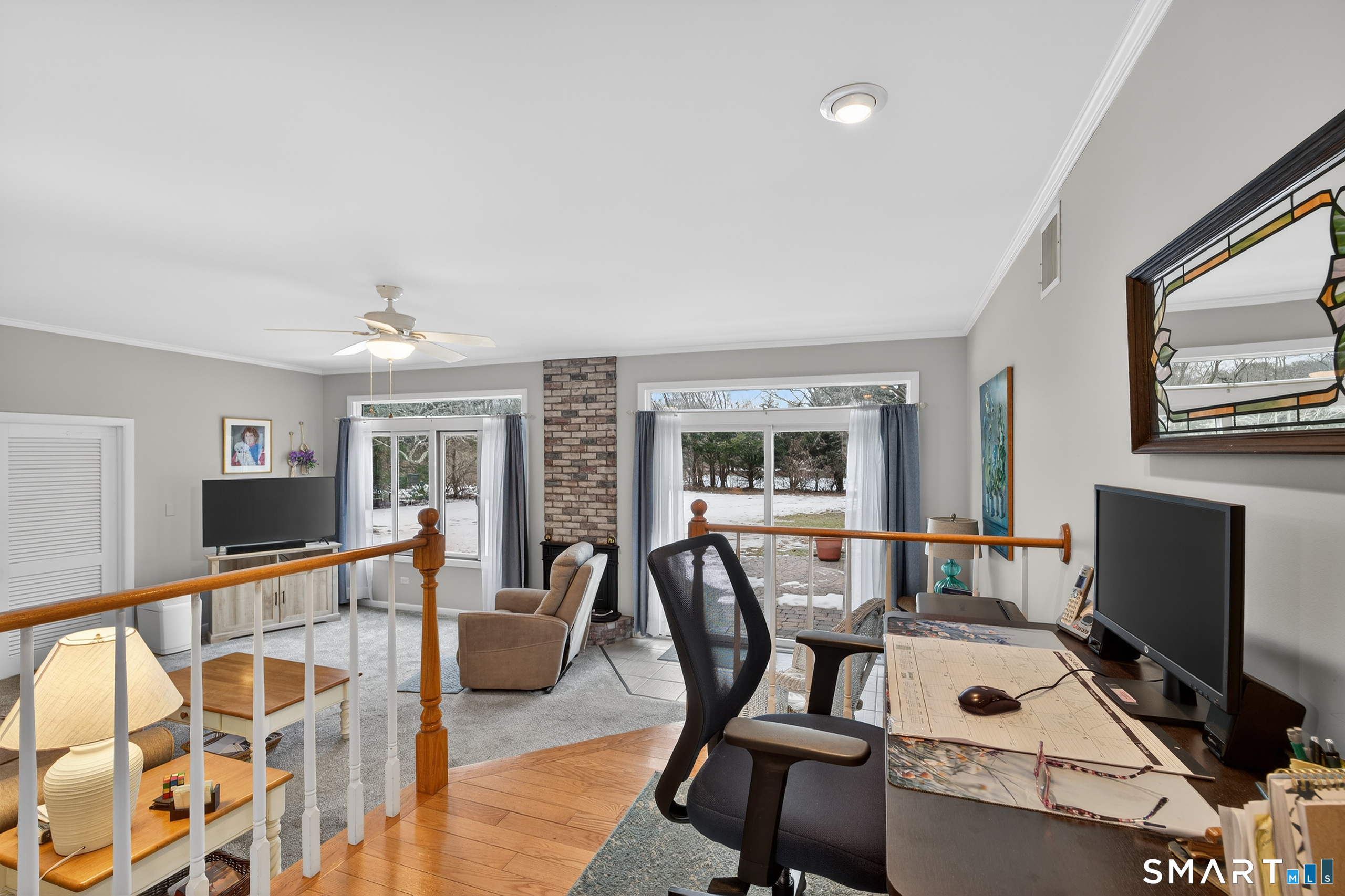 103 Maple Avenue Old Saybrook, CT 06475 - Photo 12 of 34 a work room with furniture and flat screen tv