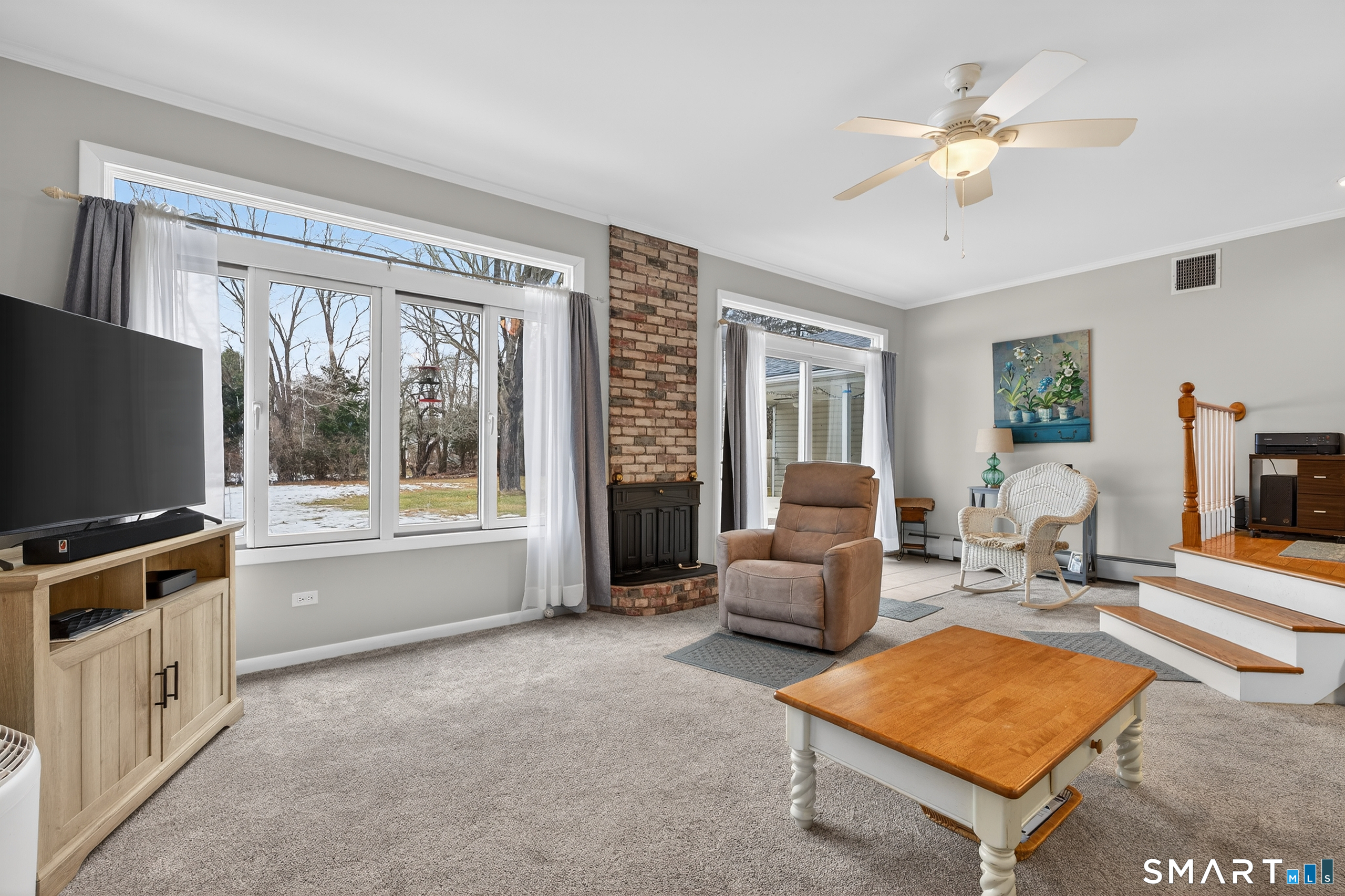 103 Maple Avenue Old Saybrook, CT 06475 - Photo 13 of 34 a living room with furniture and a flat screen tv