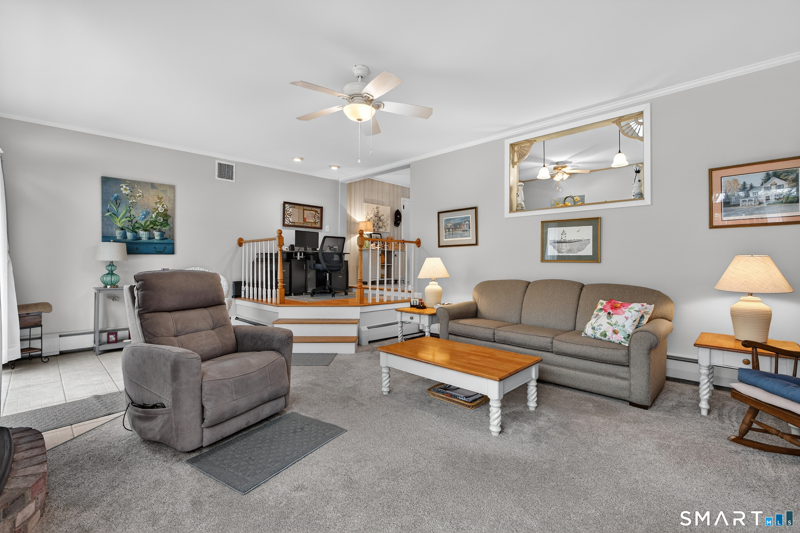 103 Maple Avenue Old Saybrook, CT 06475 - Photo 16 of 34 a living room with furniture and a flat screen tv